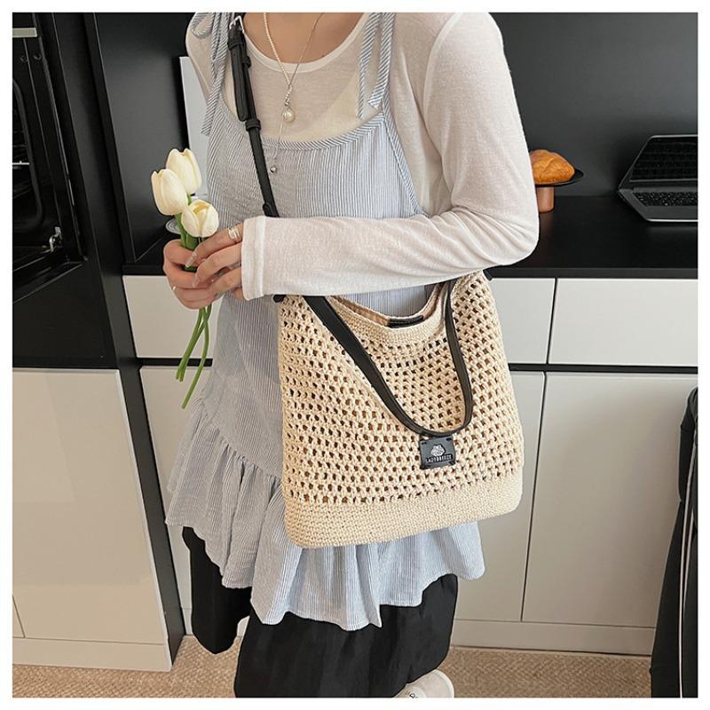 Beach woven bag women's new hollow knitted handbag large capacity shoulder crossbody armpit bag