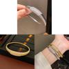 Elegant Striped Oval Bangle Bracelet With Gold Plating For Fashionable Women