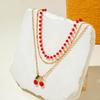 Grenzüberschreitendes rotes Reisperlen-Perlen mehrlagiges Halskettenset mit Strasssteinen Kirsche Kirschen Anhänger Halskette dreiteiliges Set