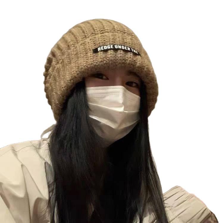 Women's Oversized Wool Beanie: Warm, Stylish, Knitted Hat with Ear Protection for Autumn & Winter.