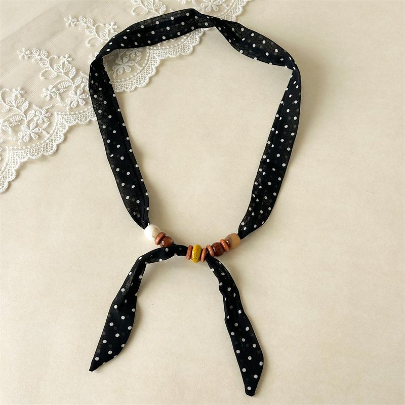 

Versatile Boho-Inspired Ribbon Hair Accessories Accented With Natural Wood-Tone Beads For A Relaxed And Earthy Style Black Dot Beaded Scarf