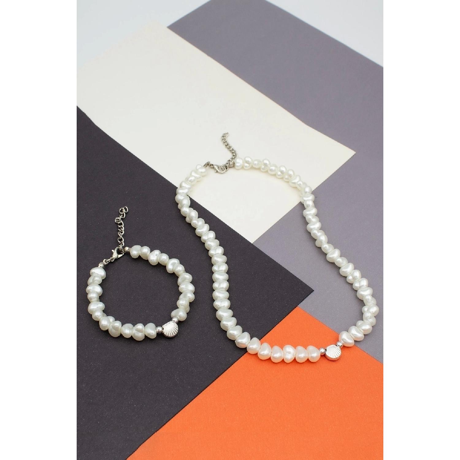 

Комплект жемчужного ожерелья-браслета в стиле барокко с фигурками морских ракушек