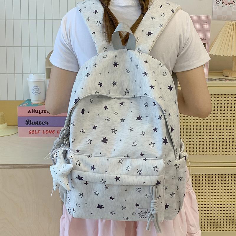 Star-Printed Backpack with Front Zipper Pocket and Tassel Details for School and Daily Use