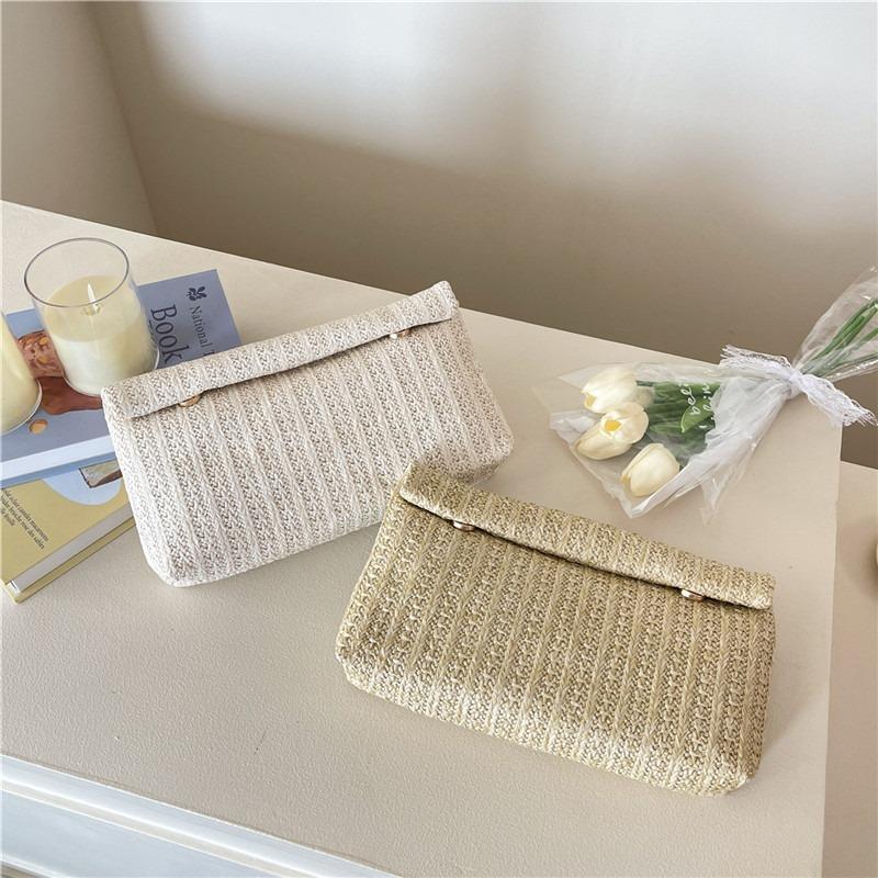 Large capacity new temperament fashionable design foreign style solid color straw woven texture hand envelope women's bag