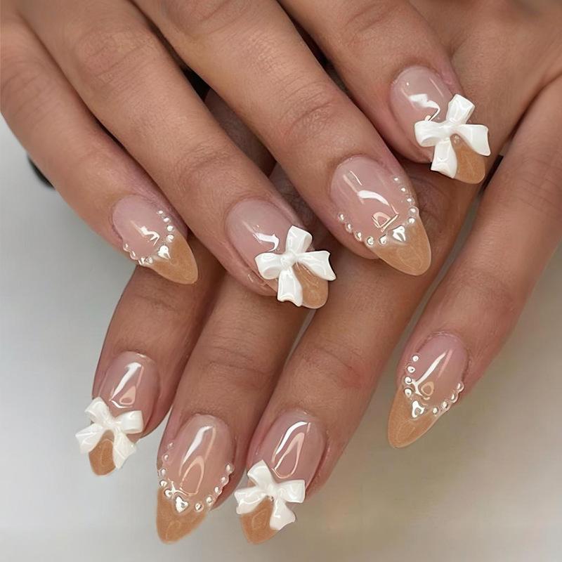 24PCS Simple Nude French Press On False Nails with Glue 3D White Bowknot Pearl Almond Fake Nails for Women Wearable Sweet Nails