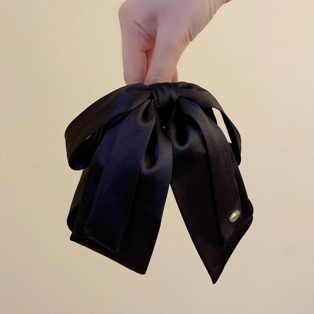 Luxuriöse Satin-Schwarze Schleife Pferdeschwanz Krallenklemme mit Goldetikett für Elegante Hochsteckfrisur