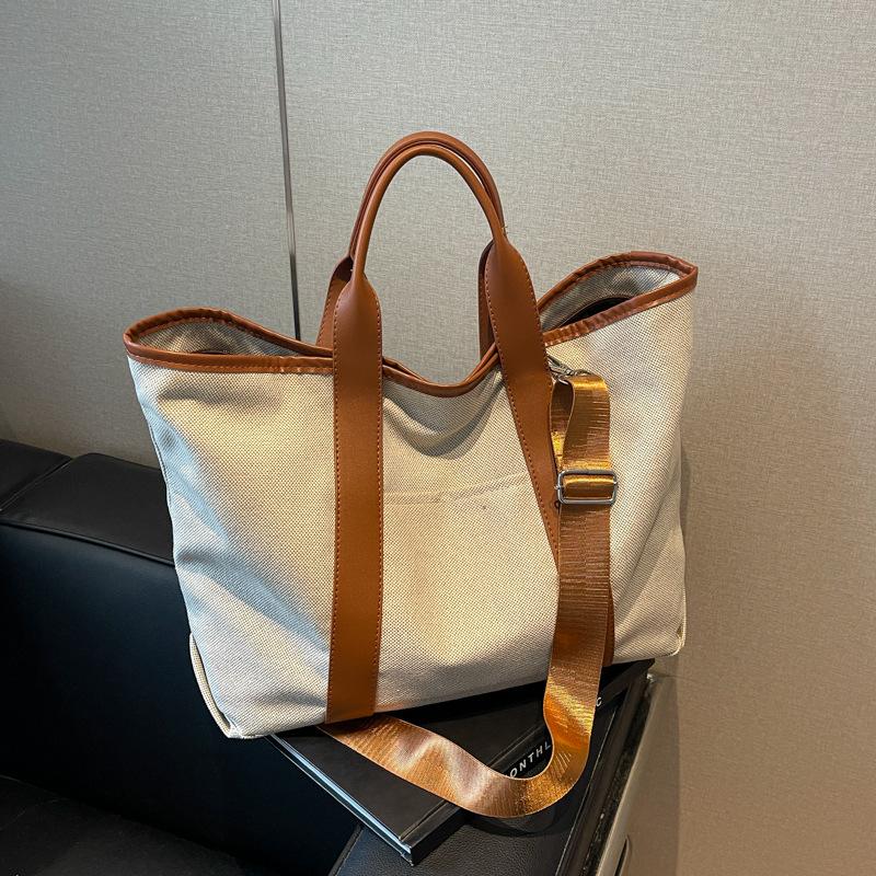 

Crossbody tote bag women s large-capacity new fashion versatile canvas casual portable shoulder bag коричневий