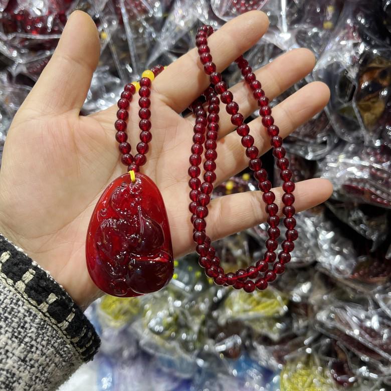 

Unisex Amber Pendant Necklace: Guanyin Maitreya Buddha Ethnic Style Sweater Chain with Water Drop and Lucky Bag Design