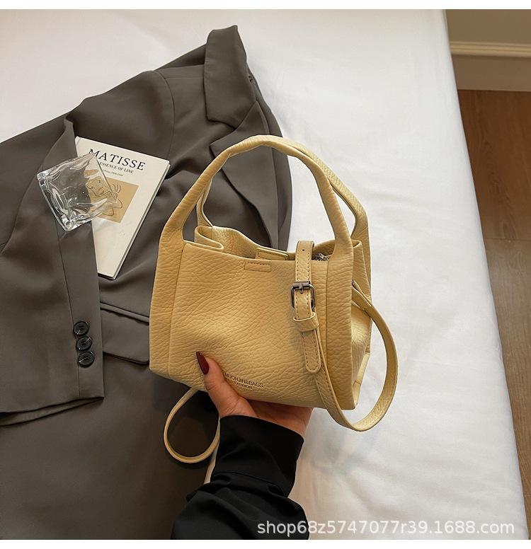 High-end hand-held bucket bag women's new 2025 trendy fashion shoulder bag niche simple casual crossbody bag
