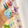 Handmade candy-colored bow bead pendant phone case chain for female students - beaded hand-held jewelry and bag accessory.