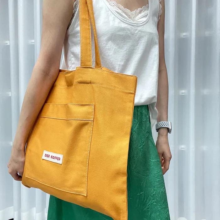 SHOPPER POCKET BAG [MUSTARD]