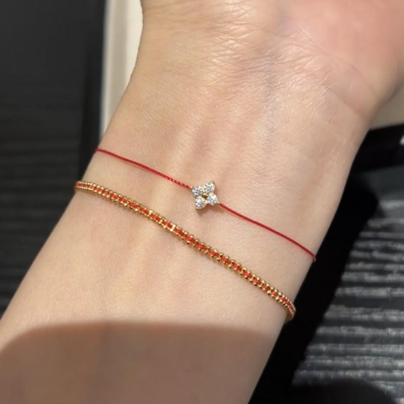 Handgewebtes rotes Schnurarmband mit vergoldetem vierblättrigem Klee-Anhänger für Damen, Paare, Luxuriöser minimalistischer Stil