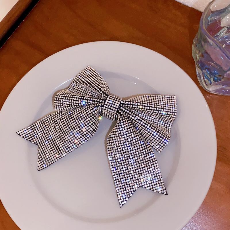 Korean version of fashion bow hairpin niche simple and versatile temperament spring clip advanced semi-drape hairpin