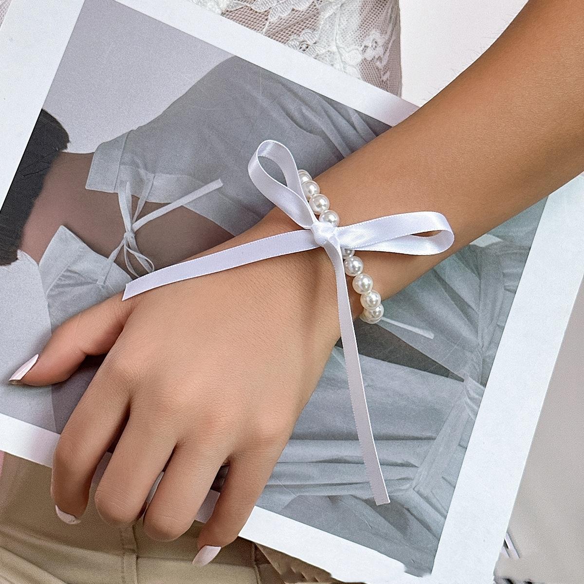 

Модні ювелірні вироби для весільної вечірки Довге намисто-кольє з чорною стрічкою для жінок Елегантні білі пляжні намиста з імітацією перлин білий