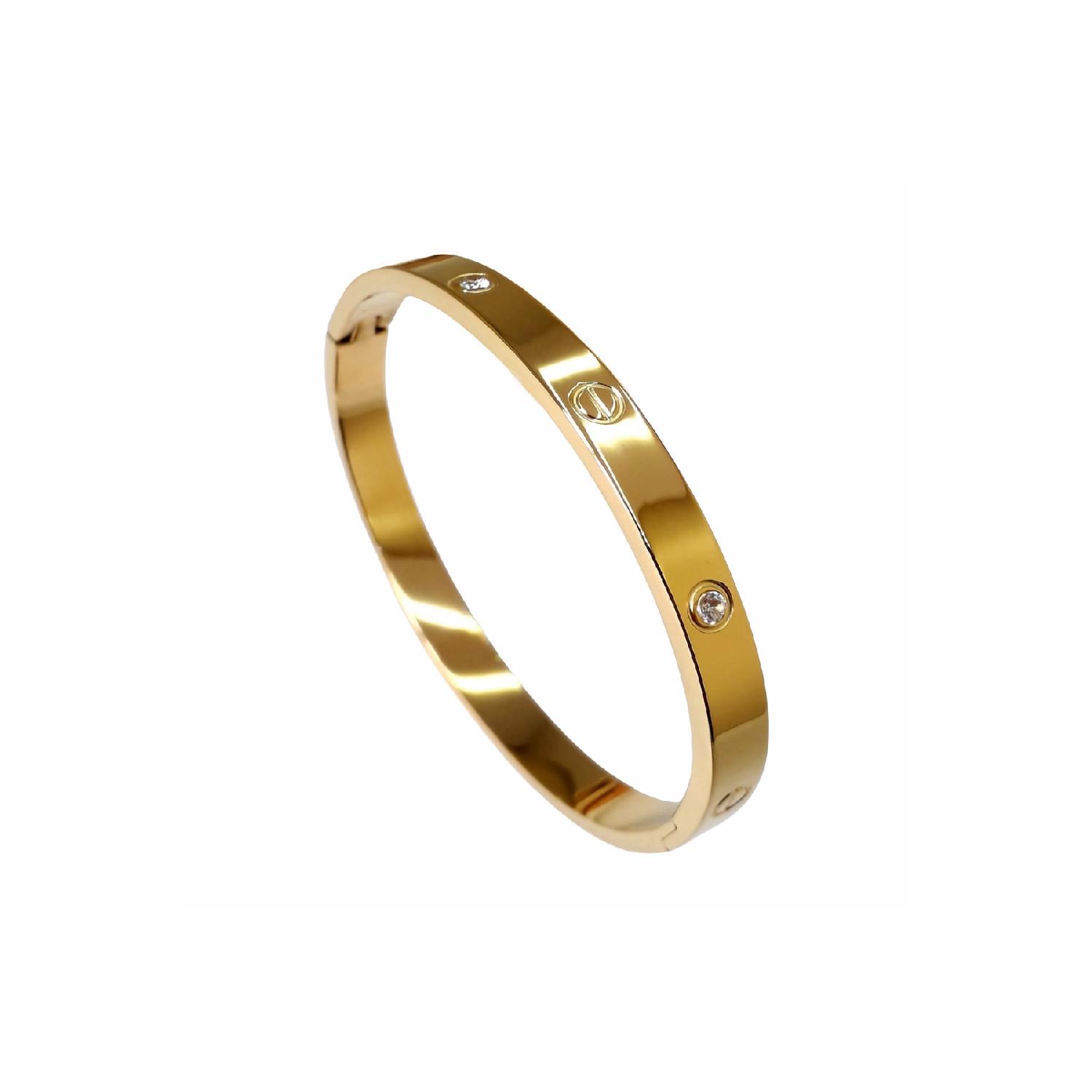 

Женский стальной браслет-наручники золотого цвета