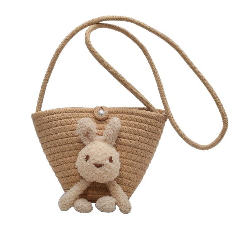 Summer cute oblique bucket bag women's straw woven outdoor travel beach bag versatile plush rabbit shoulder bag