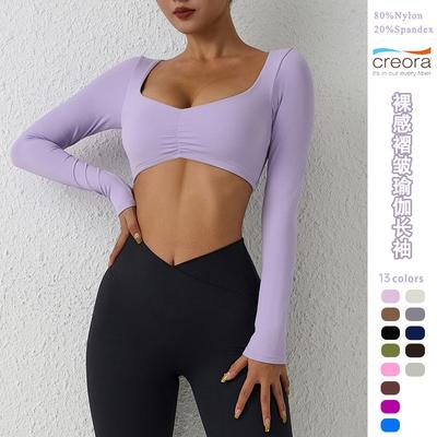 Top da yoga fitness a maniche lunghe plissettato nudo europeo e americano per donna