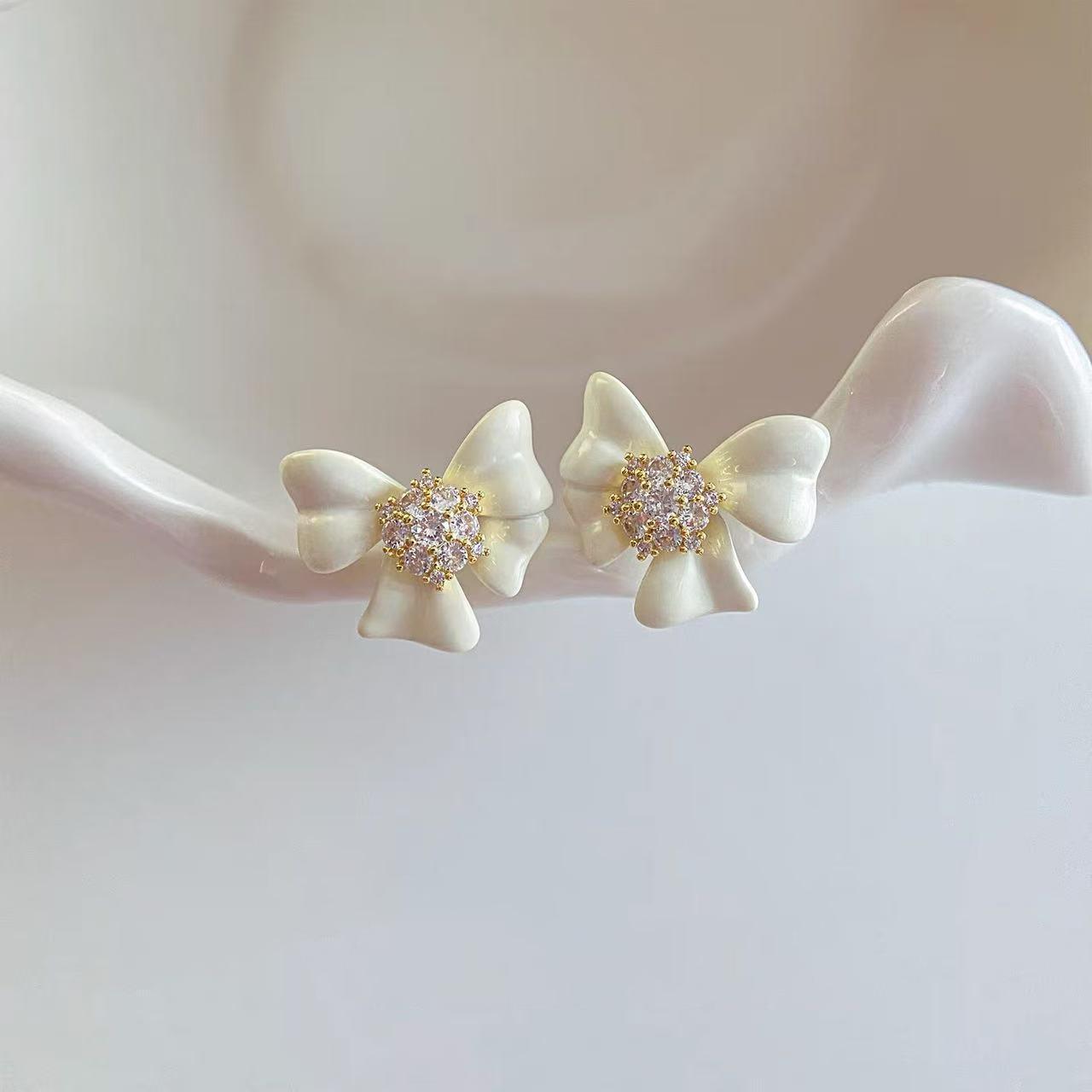 

French gentle and sweet white bow stud earrings women s light luxury earrings ears