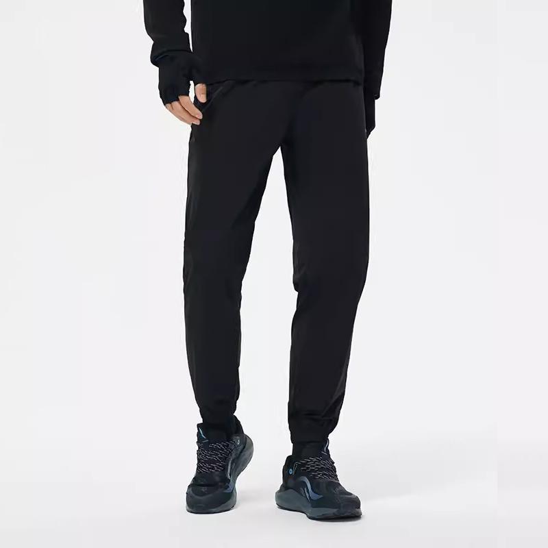 Li Ning Running Series Solid Color Mid Waist Comfortable Versatile Breathable Tapered Knit Sports Pants Men Bottoms Black YKLU271-1