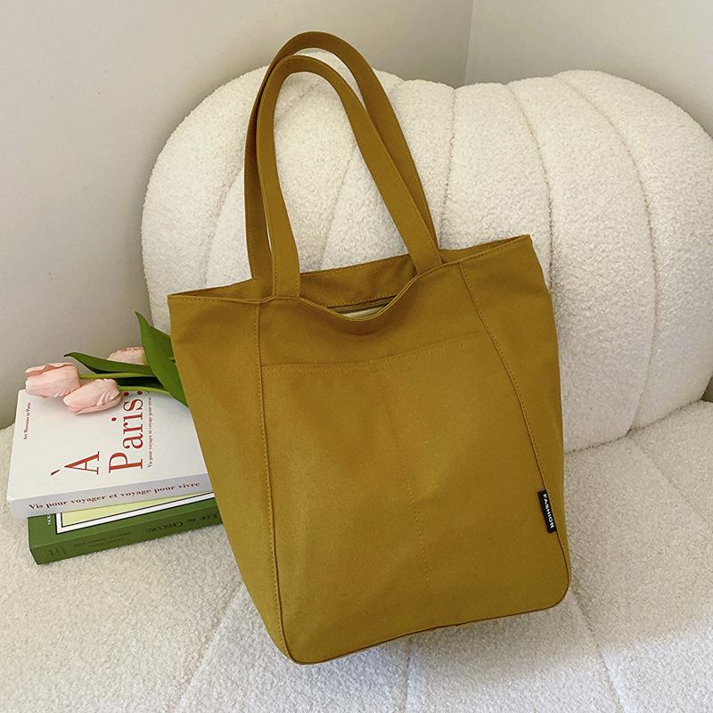

2025 new Korean version large-capacity ins simple lazy style canvas bag, student class versatile commuter tote bag хакі