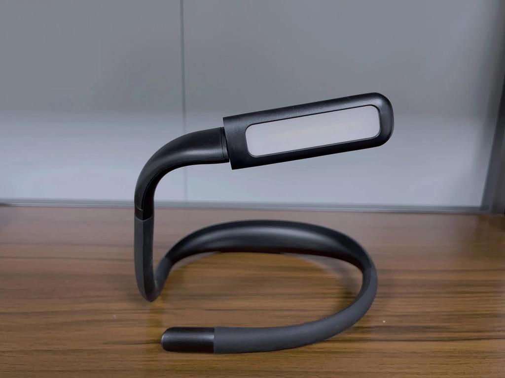 Rechargeable Neck-Hanging LED Reading Light with Eye Protection and Foldable Design for Students and Bedside Use.