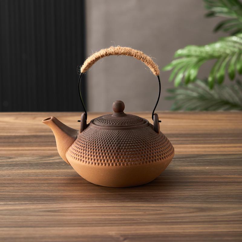 Ceramic Kung Fu Tea Set: Black Teapot with Side Handle and Charcoal Stove for Open Fire.