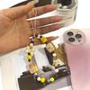 Ins-Style Cartoon Bear Toast Phone Lanyard: Cute Beaded Anti-Lost Pendant & Camera Charm