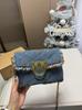 Bolso de Cadena de Denim con Golondrinas y Hebilla Dorada con Borlas