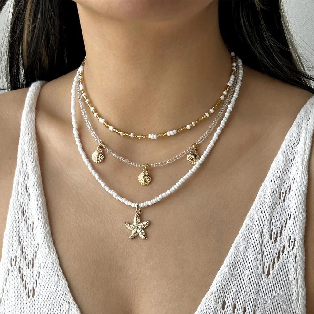 Handgefertigter mehrschichtiger gestapelter Choker aus Reiskörnern für Damen Einfacher Seestern-Muschel-Anhänger Halskette Bohemian Strand Schmuck Geschenke