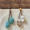 Irregular resin long necklace women's niche retro ethnic style wax rope sweater chain high-end sense item decoration
