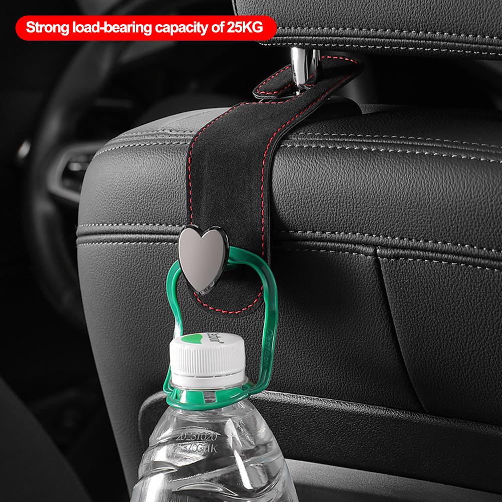 Kopfstützenhaken für Autositze 2 in 1 Leder Herzform Metall Rückenlehnenhaken Handtaschen- und Taschen-Rucksack Doppelhaken Sitzaufhänger