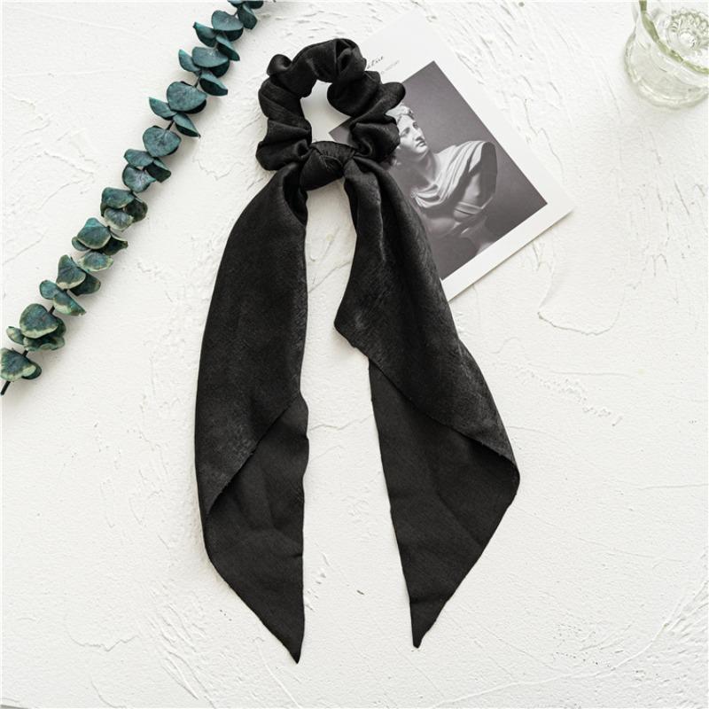 Long flowing ribbon large braided hair accessory for women - ponytail bun hair band with floral design, simple and elegant.