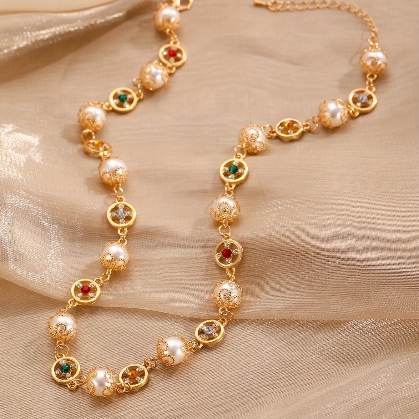 

A Stylish and Exquisite Imitation Pearl Necklace with Rhinestone Embellishments, Beaded Accents, and a Hollow-out Floral Design. Golden Yellow
