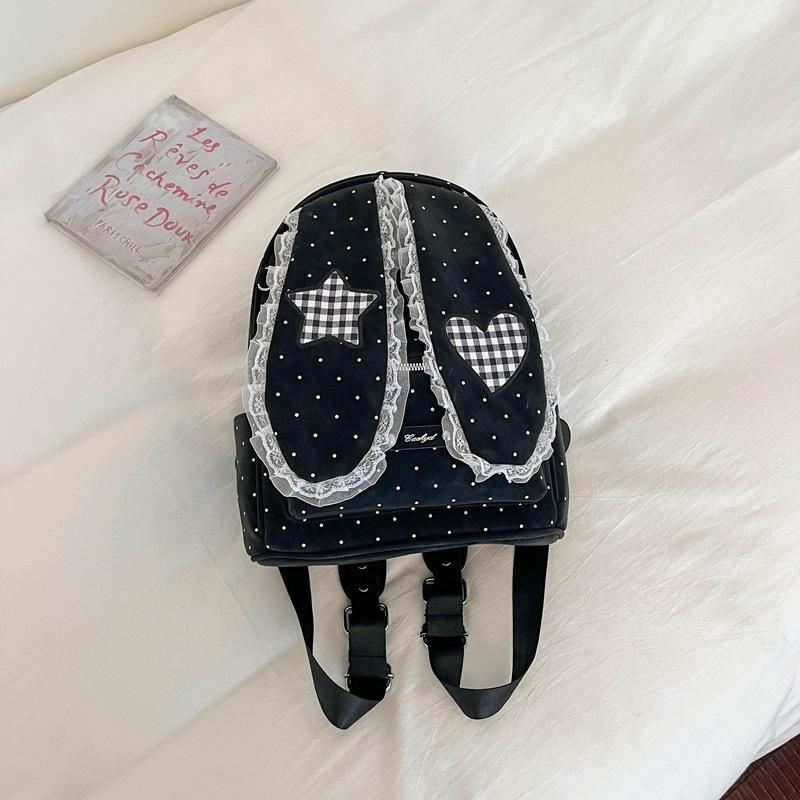 Schoolbag handsome rice family Korean simple foreign style polka dot love rabbit ear backpack 1011 spring new commuter student backpack