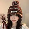 Cozy Chic Knitted Winter Hat For Women Featuring Colorful Pom Poms And Warmth