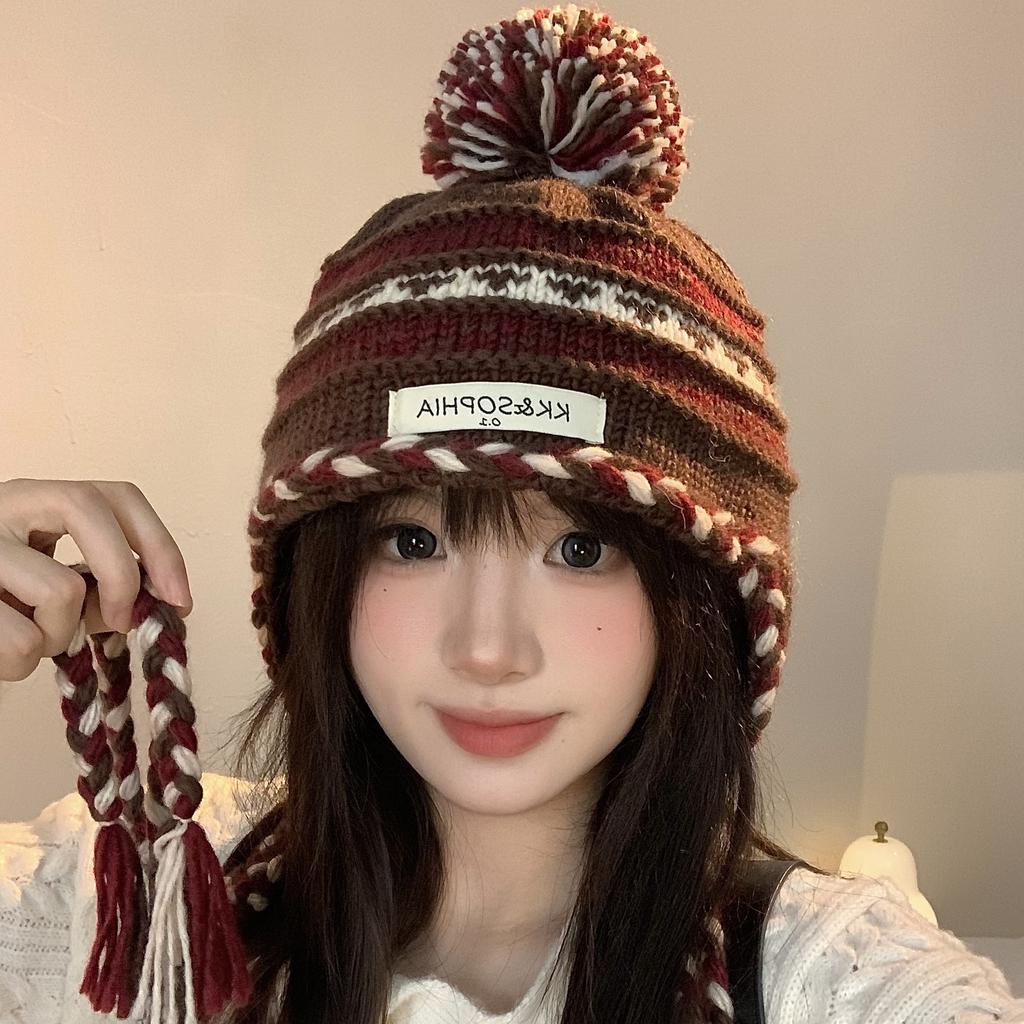 Cozy Chic Knitted Winter Hat For Women Featuring Colorful Pom Poms And Warmth