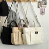 Borsa tote portatile per studentesse urbane minimaliste, grande capacità, pendolarismo, tela orizzontale, spalla singola, croce diagonale