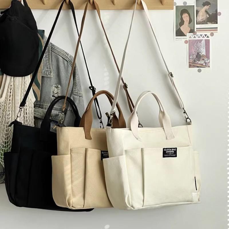 Borsa tote portatile per studentesse urbane minimaliste, grande capacità, pendolarismo, tela orizzontale, spalla singola, croce diagonale