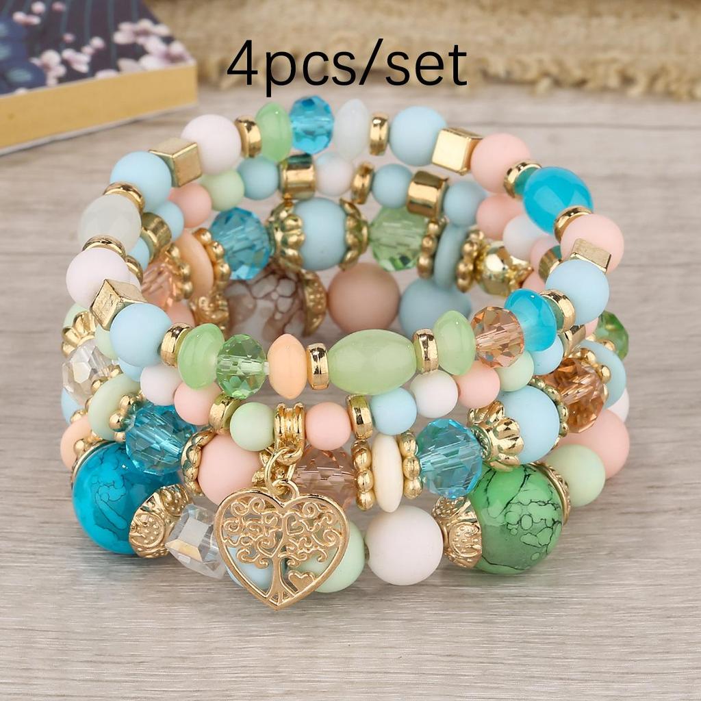 Bohemian Multi-Layer Tassel Bracelet Set with Hollow Heart Pendants and Glass Beads.
