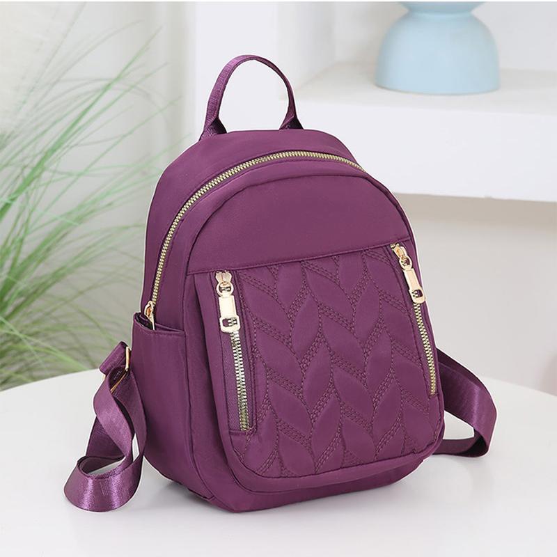 

Высококачественный нейлоновый городской модный женский рюкзак большой вместимости на молнии в минималистичном повседневном стиле для студентов 21x10x17cm фиолетовый