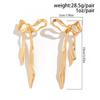 Ingemark Vintage Goldfarbene Schleife Schleifenknoten Lange Quaste Hängende Ohrringe für Damen Klassische Hängende Piercing-Ohrringe Hochzeits Schmuck Geschenk