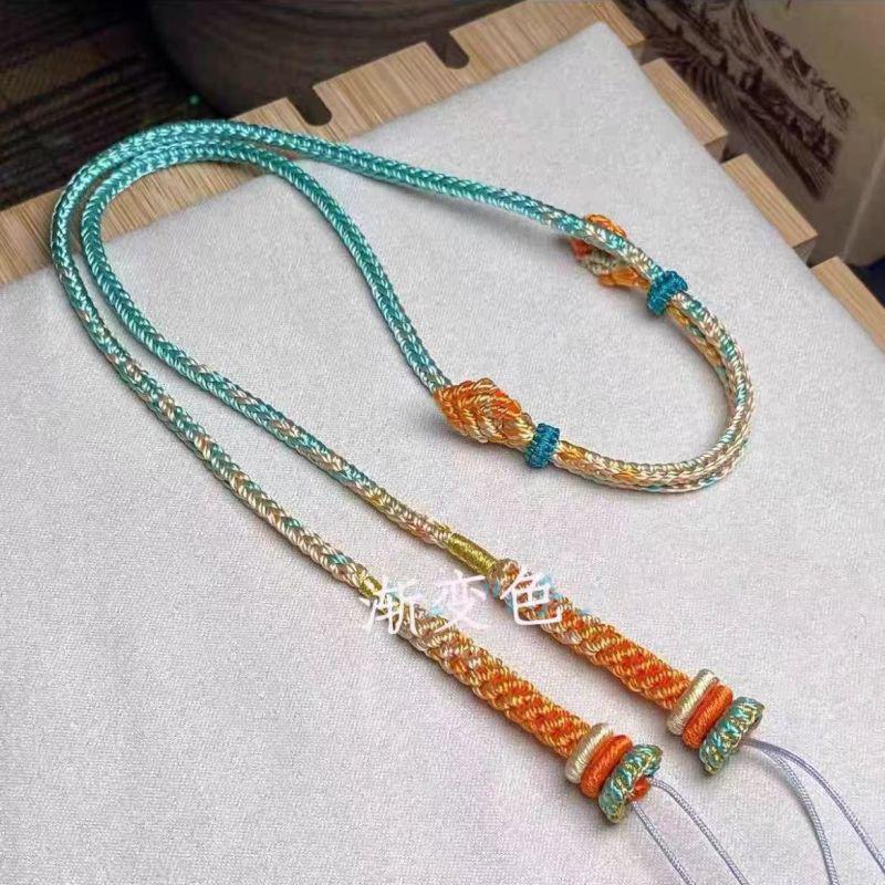 Adjustable Pendant Necklace with Handmade Woven Cord, Featuring Jadeite, Amber, Nanhong, and Hetian Jade Stones.