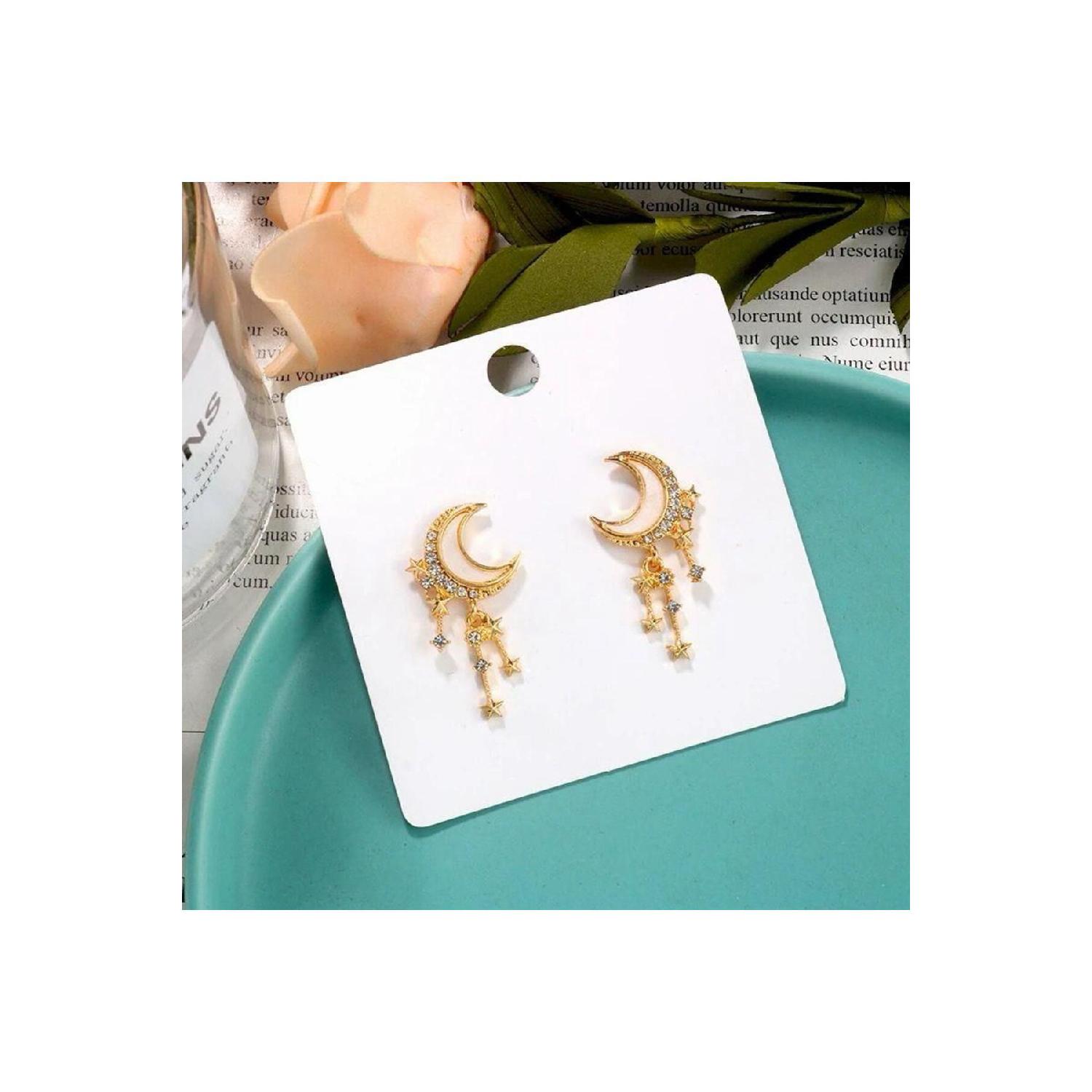 

Кремовые серьги со звездами и луной кремовый