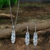 A retro ethnic-style ladies' earring and necklace set, featuring antique silver-colored leaves set in alloy and adorned with turquoise accents,