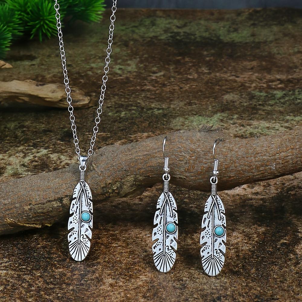 A retro ethnic-style ladies' earring and necklace set, featuring antique silver-colored leaves set in alloy and adorned with turquoise accents,