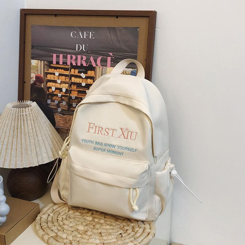 School bag Korean version ins style versatile junior high school student school bag solid color letter backpack high value simple lightweight backpack