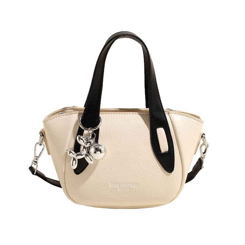 

Foreign contrast crossbody bag women s new summer simple texture shoulder bag Korean niche design commuter bucket bag