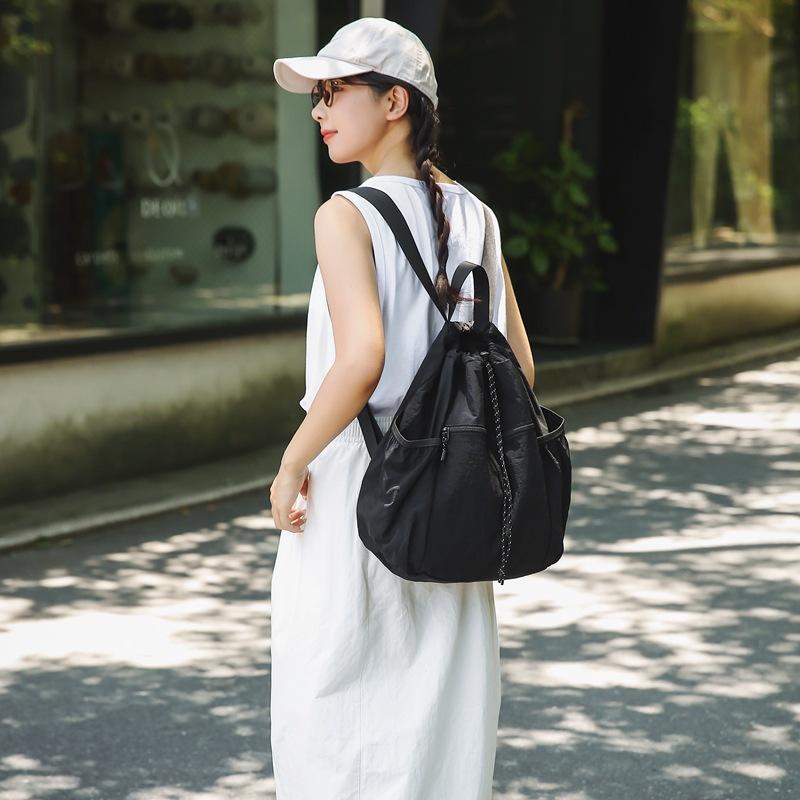 Schoolbag Korean version of nylon cloth niche design schoolbag women's casual lightweight drawstring backpack large capacity versatile simple backpack