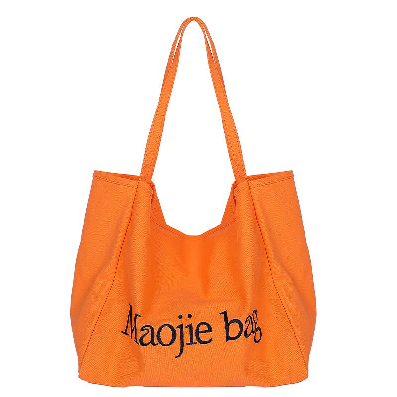 Large-capacity canvas bag, new niche versatile casual class commuting portable shoulder tote bag
