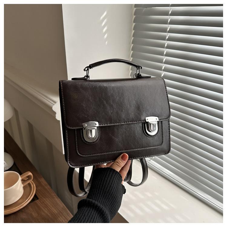 

Британский стиль ретро простой женский замок популярный модный простой портативный рюкзак рюкзак темно-коричневого